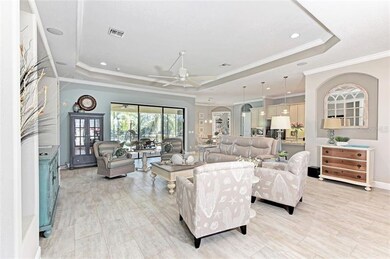 Great room with built ins, plank tile flooring and