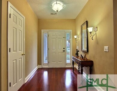 Foyer. Elegant Foyer Showcases Hardwood Floors and