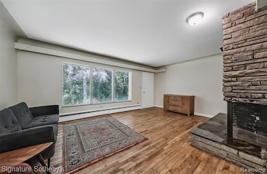 2-sided raised stone FP and picture window in living room