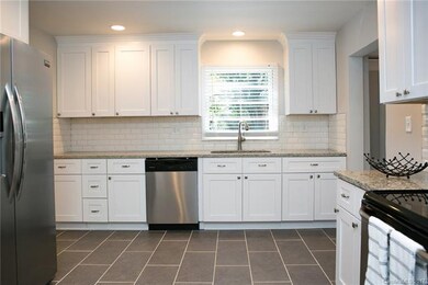 All new Shaker soft close cabinets and granite cou