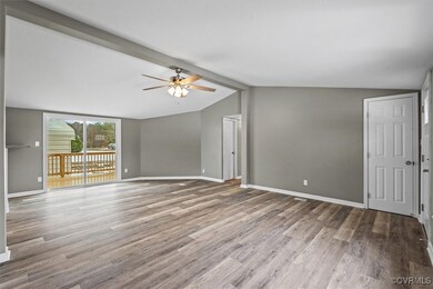 Unfurnished living room with wood finished floors,