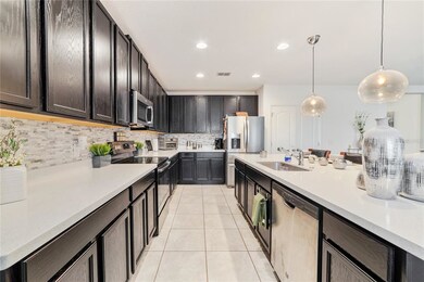 This awesome KITCHEN offers QUARTZ COUNTERS, a STO
