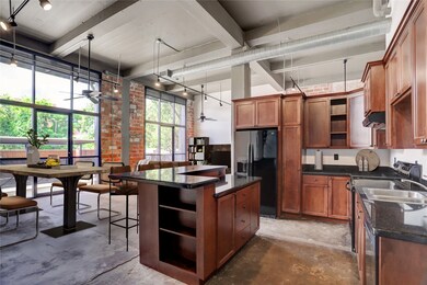The open-concept layout puts the kitchen at the he
