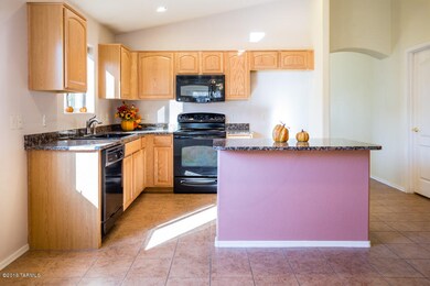 Tiled kitchen with marble counter tops
