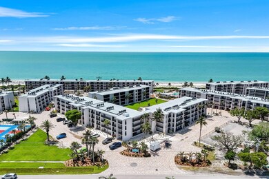 Bird's eye view of a nearby body of water and apartment complex / building