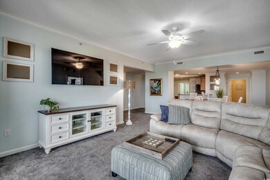 Carpeted living room with a textured ceiling, visi
