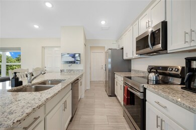 The galley style kitchen is very efficient leading