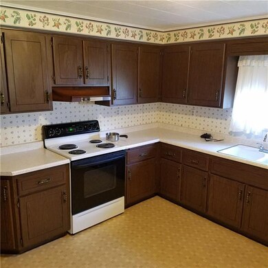 Large eat in kitchen with plenty of cabinets.