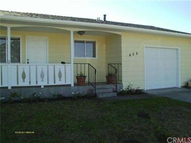 Front of home with new garage door.
