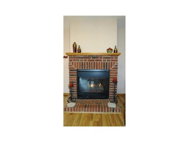 Fireplace. BRICK SURROUND GAS FIREPLACE TO COZY UP