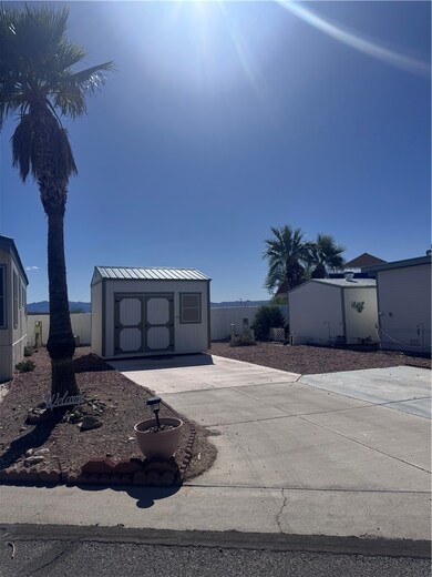 View of front of property with an outdoor structur