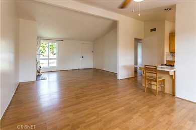 Dining room to front door. Tall ceiling