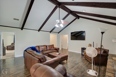 Living room featuring dark wood-type flooring, cei