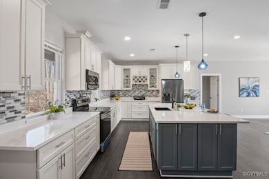Kitchen includes stainless steel appliances, farm