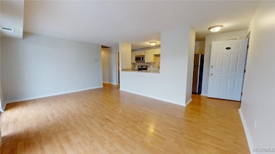 Unfurnished living room with light hardwood / wood