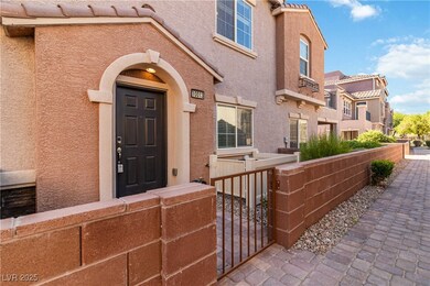 Doorway to property with stucco siding, a gate, an