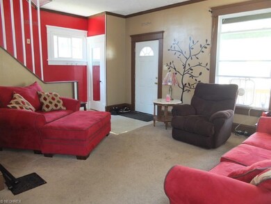 Spacious living room with crown molding.