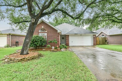 The mature oak tree seen in this picture will welcome you home every time you drive up. It is only one out of the four that shade this beautiful house.