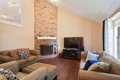 Living Room with dramatic brick fireplace.