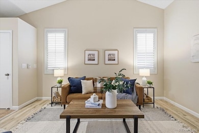 Light and bright living room, vaulted ceilings, plantation shutters throughout