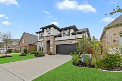 Welcome to your dream home in Cypress built by New Mark in 2021, this stunning two-story residence boasts a beautiful modern elevation of brick and stucco.