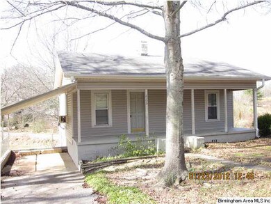 Carport to left of home. Window unit air condition