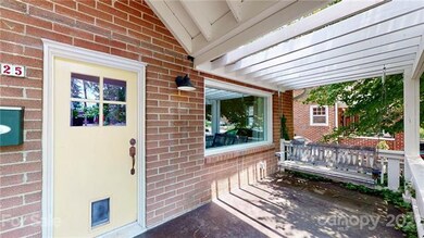 Covered front porch with porch swing.