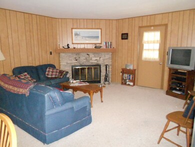 livingroom has a nice wood fireplace