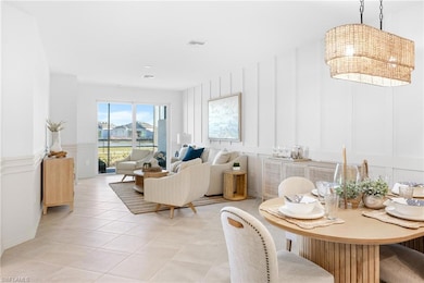 Dining space featuring a decorative wall and light tile patterned flooring