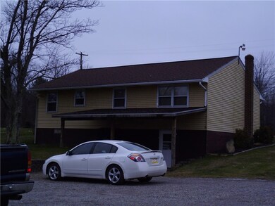 Back exterior with off street parking.