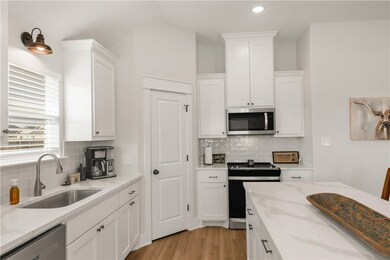 Kitchen featuring appliances with stainless steel