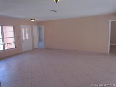 View to entry way - interior fully tiled for easy 