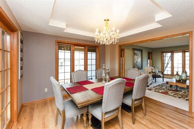 formal dining with trey ceiling & wood floors
