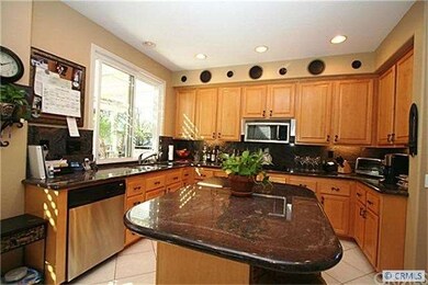 Gleaming granite counters and island.