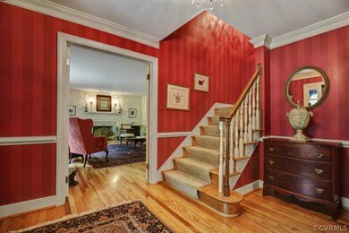 Wide entrance Foyer with gorgeous wood flooring is