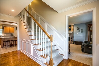 Step inside to find gleaming hardwood floors and charming wainscot that surrounds the entry hallway.