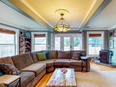 Large living room area featuring pellet stove, exp