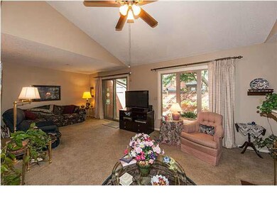 L Shape living room with doors leading out to deck