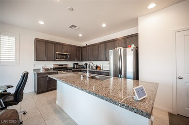 Kitchen with stainless steel appliances, a sink, d