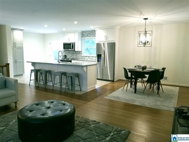 The 100% new kitchen has granite countertops, stai