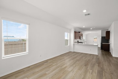 Unfurnished living room with light wood-style flo