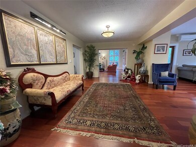 Entry foyer with family room on the right with liv