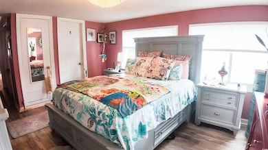 Bedroom with wood finished floors