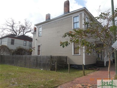East side of the building.  Note fenced yard.