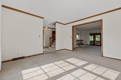 Living Room looking to Entry Way and Family Room