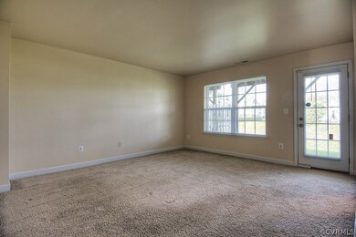 Bedroom 2 on the 1st level with wall to wall carpet, closet and private bath