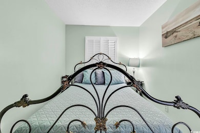 Bedroom featuring a textured ceiling