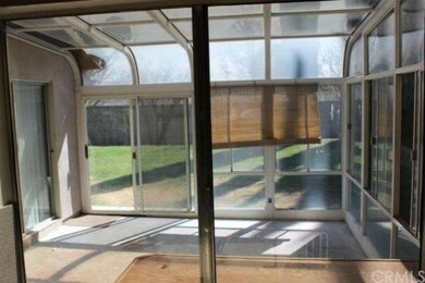 Sunroom with Pass Through Window from Kitchen