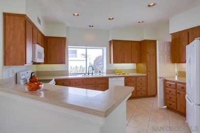 The kitchen features lots of counter space and rol