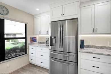 Kitchen with recessed lighting, stainless steel fr